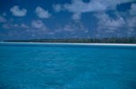 Midway Island with lagoon and clouds sky